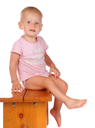 portrait of a little girl on a stoolの写真素材