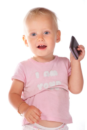 portrait of a little girl with a telephoneの写真素材