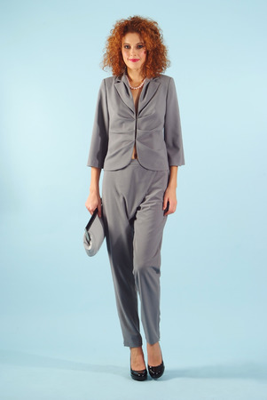 girl poses in grey business suitの写真素材