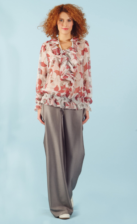 red haired girl paces on blue backgroundの写真素材