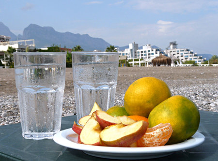 Fruits with glasses on a background of mountainsの写真素材
