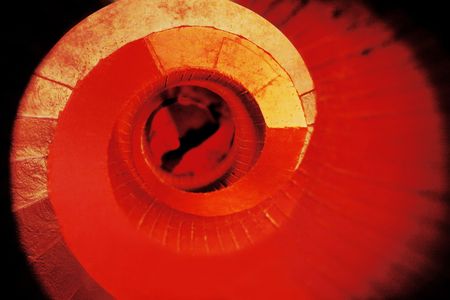 Photo manipulation of a red staircase in a library.の写真素材