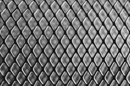 Macro photograph of a pen holder made of iron net.の写真素材