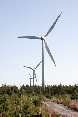 Modern windmill producing renewable energy ecologically.