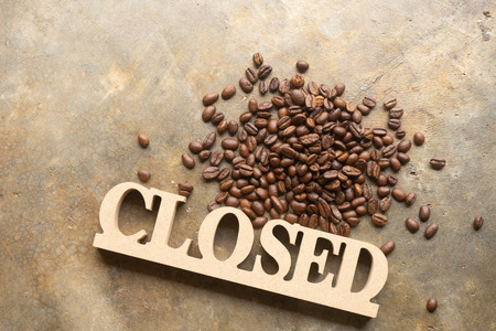 Decorative letters word CLOSED with coffee bean on texture background for cafe.の写真素材