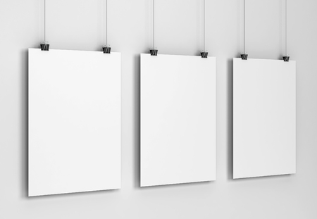 Blank poster hanging on a wall mockup. 3d illustration on gray backgroundの写真素材