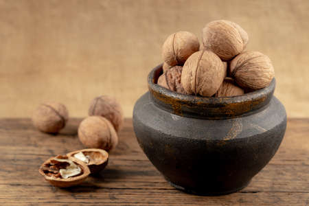 group of walnuts on a wooden backgroundの写真素材
