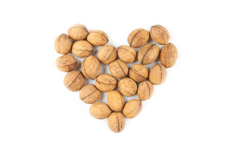 heart shape from collection of a walnuts. isolated on white backgroundの写真素材