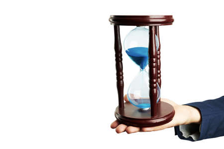 person hold in his hand hourglass with blue running sand. time symbol. copy space. isolated on white...