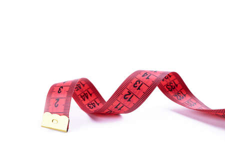 slim concept. red measuring tape isolated on a white background. healthy eating concept