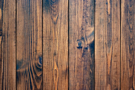 brown oiled wooden plank background. clean and empty backdrop for design. wooden frame for mockup. looking aboveの写真素材