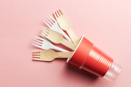 wooden and plastic forks at paper and plastic cup. eco-friendly and disposable with plastic recycling concept. plastic waste conceptの写真素材