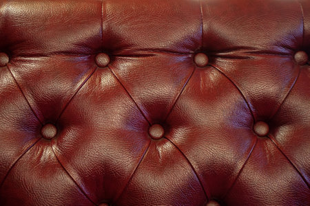 luxury brown leather sofa backdrop. closeup decor for design backgroundの写真素材