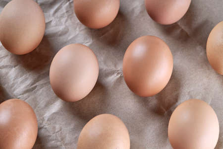 hen eggs background backdrop. stack of eggs over paper background