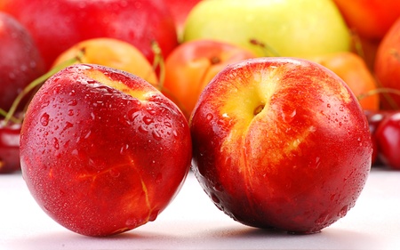 Two nectarines with visible drops of waterの写真素材