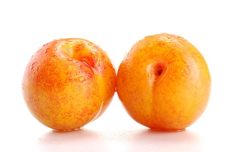 Plums isolated on whiteの写真素材