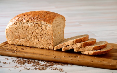 Loaf of bread on breadboard