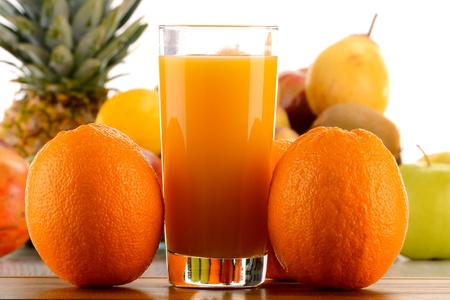Glass of orange juice and fruitsの写真素材