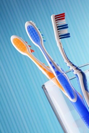 Toothbrushes on blue background の写真素材