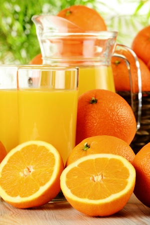 Composition with glasses of orange juice and fresh fruits の写真素材