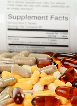 Composition with dietary supplement capsules and containersの写真素材