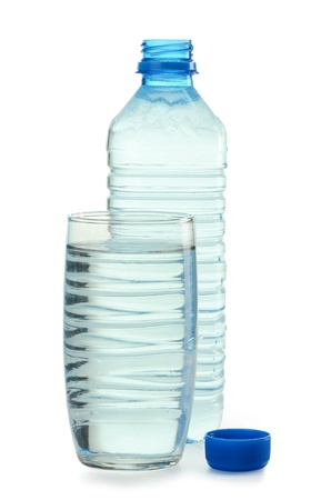 Polycarbonate plastic bottle of mineral water and glass of water isolated on whiteの写真素材