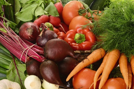 Composition with raw vegetables and wicker basket