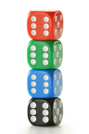 Composition with four colorful dices isolated on white