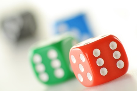 Composition with four colorful dices isolated on white