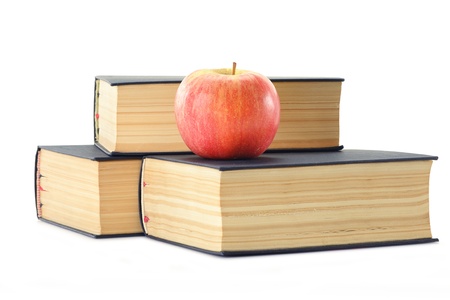 Composition with stack of books and apple isolated on whiteの写真素材