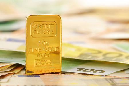 Composition with gold bar and Euro banknotes  European Union currencyのeditorial素材
