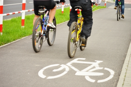 Bicycle road sign and bike riderの写真素材