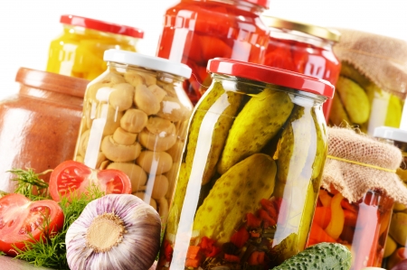 Composition with jars of pickled vegetables. Marinated foodの写真素材