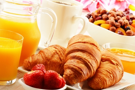 Breakfast with croissants, cup of coffee and fruitsの写真素材