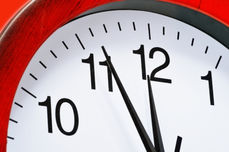 Wall clock showing five to twelveの写真素材