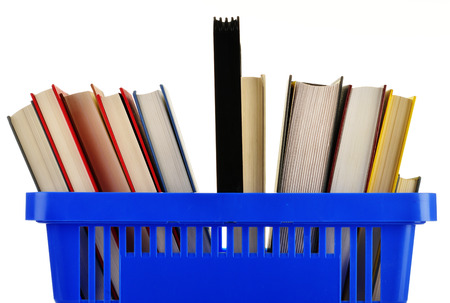 Plastic shopping basket with books isolated on whiteの写真素材