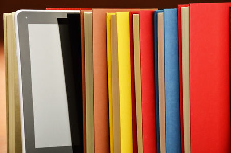 Composition with books and tablet computer on the table の写真素材