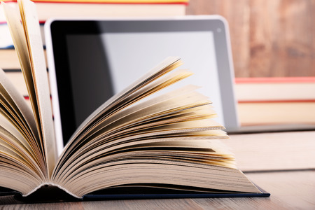 Composition with books and tablet computer on the table.の写真素材