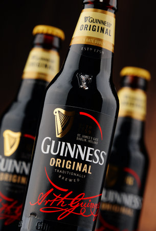 POZNAN, POLAND - NOVEMBER 5, 2015: Irish dry stout, originated in the brewery of Arthur Guinness, Dublin. One of the most successful beer brands in the world, available in over 100 countriesのeditorial素材