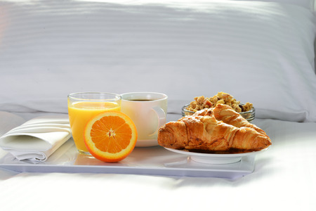 Breakfast in bed in hotel room. Accommodation.の写真素材