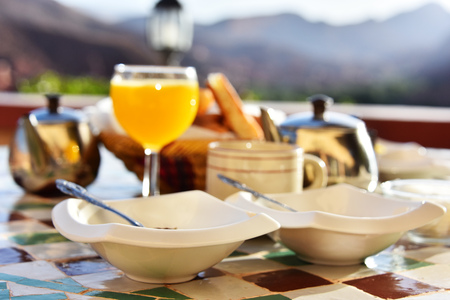 Moroccan breakfast served on hotel terrace in Atlas Mountains.の写真素材