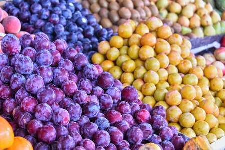 Variety of fresh ripe fruits on street market stall.の写真素材