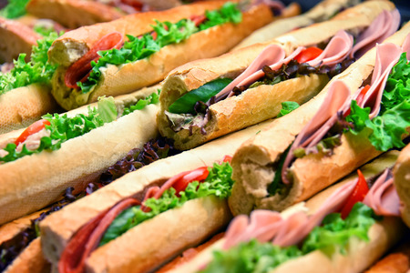 Sandwiches with vegetables and ham sold in fast food restaurant.の写真素材