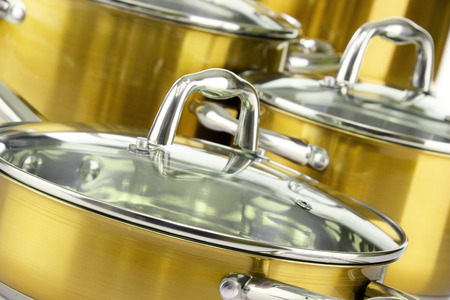 Composition with four steel pots.の写真素材