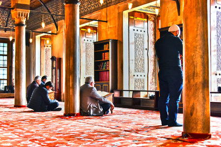 ISTANBUL, TURKEY - APR 23, 2017: Men praying in Sultan Ahmed Mosque or Blue Mosque in Istanbul, Turkeyのeditorial素材