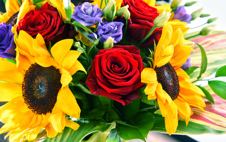 Composition with bouquet of flowers including sunflowers and rosesの写真素材