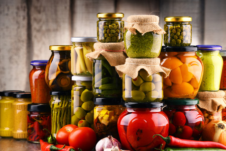Jars with variety of pickled vegetables. Preserved foodの写真素材