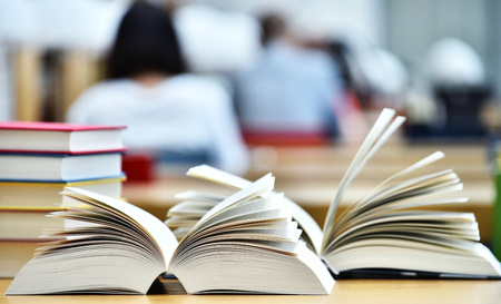 Books lying on the table in the public library.