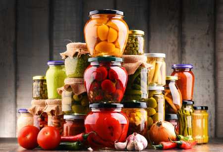 Jars with variety of pickled vegetables. Preserved foodの写真素材
