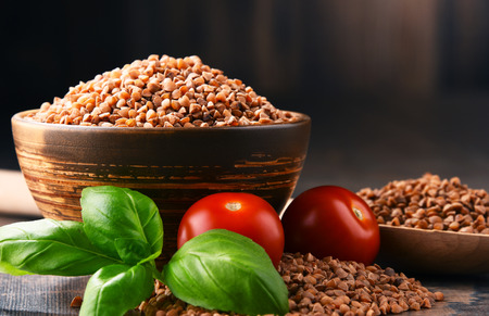 Bowl of buckwheat kasha on wooden table.の写真素材